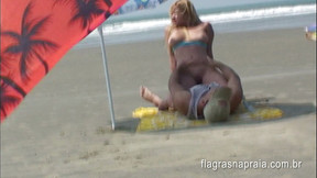 Brazilian couple having sex on the empty beach