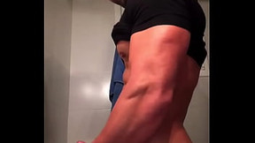 Latin beauty shows off muscular body while spraying load
