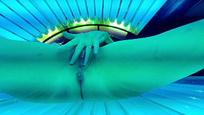Trixie has fun in the tanning bed