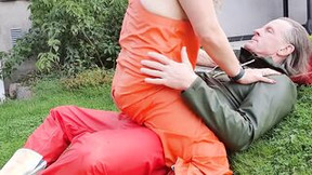 Rides gigantic cock into orange rainpants and latex boots - outdoors into bigg boobies