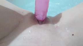 Hard fucking with a dildo in the bathroom close-up