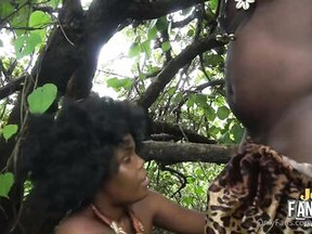 Flirty Afro lady with ample assets is getting banged in the forest and enjoying it a lot