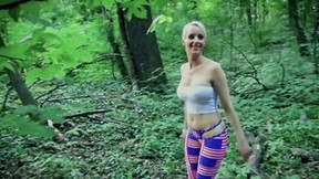 Short-haired blonde girl is sucking some cock in the woods