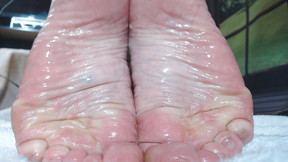 Slick oiled wrinkled soles closeup