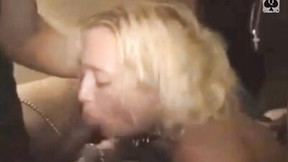 Blonde MILF wraps her lips around humongous black cock and sucks it