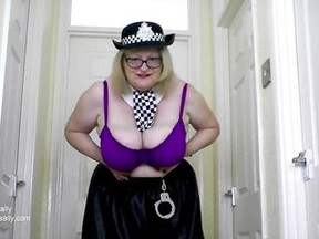 London â older Policewoman in uniform with very large boobs