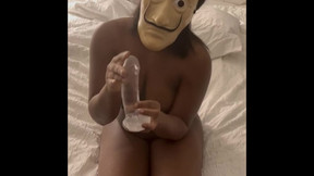 Silly mask SAGBUTTZ natural ebony rides clear dildo and takes it with legs up
